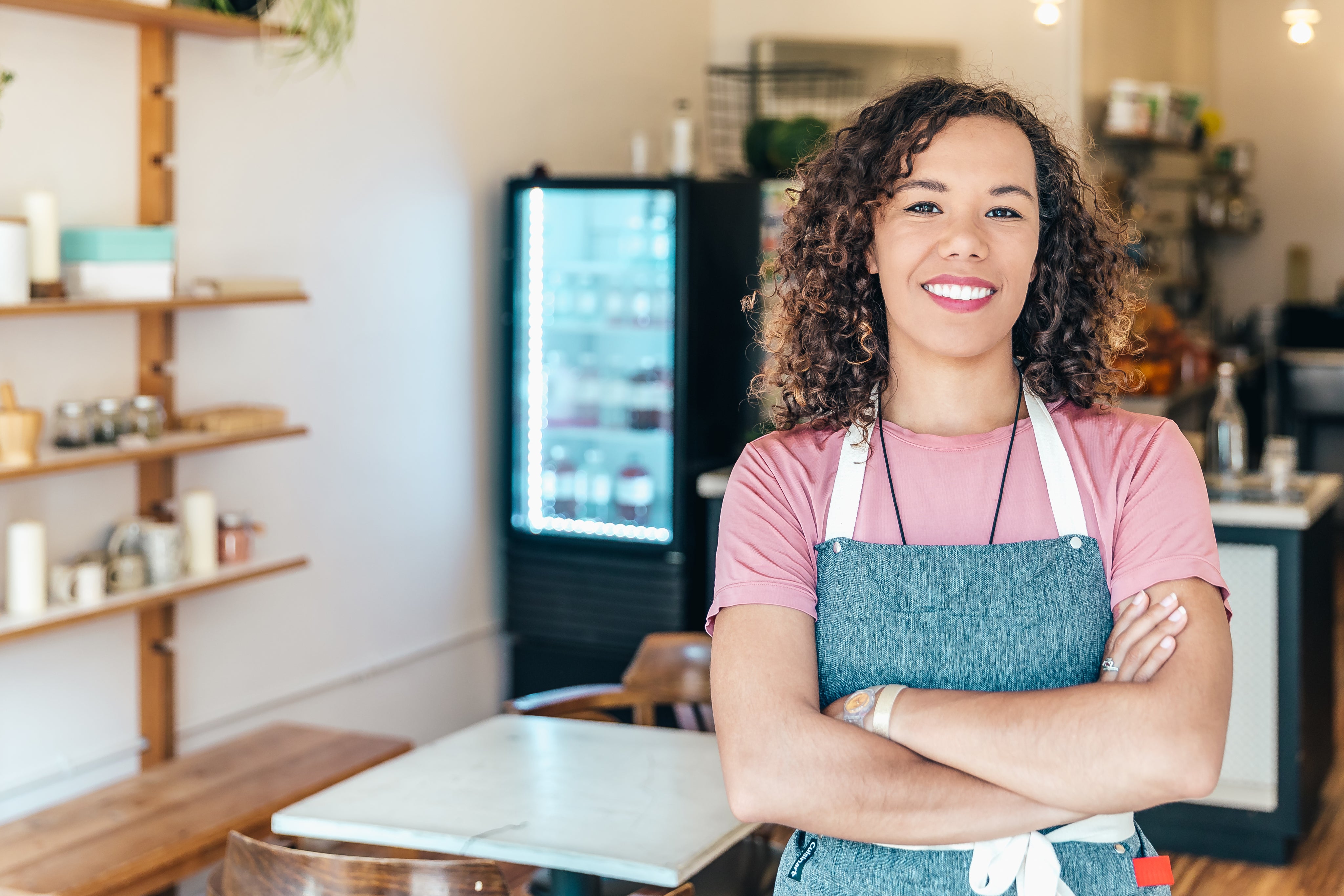 files/a-barista-smiles-proudly-stood-in-her-cafe.jpg